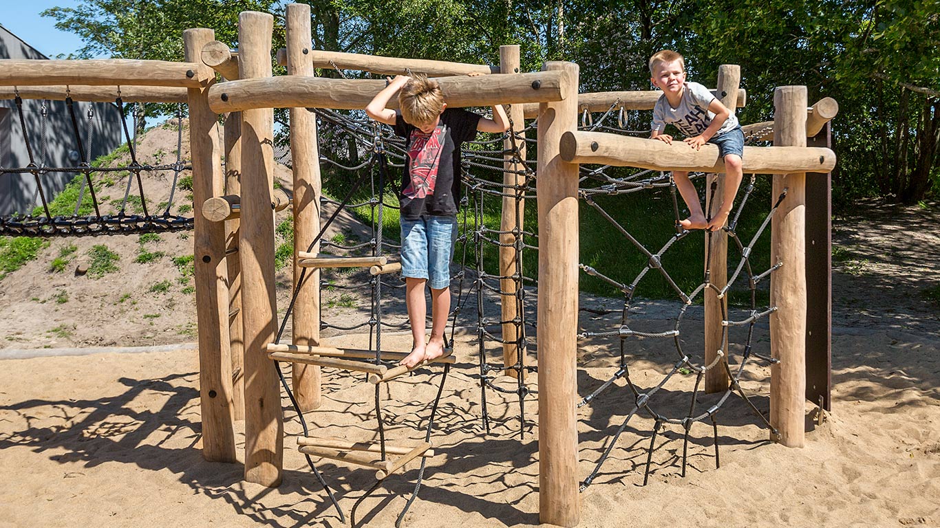 Boys climbing and play on a climbing system form NORNA PLAYGROUNDS